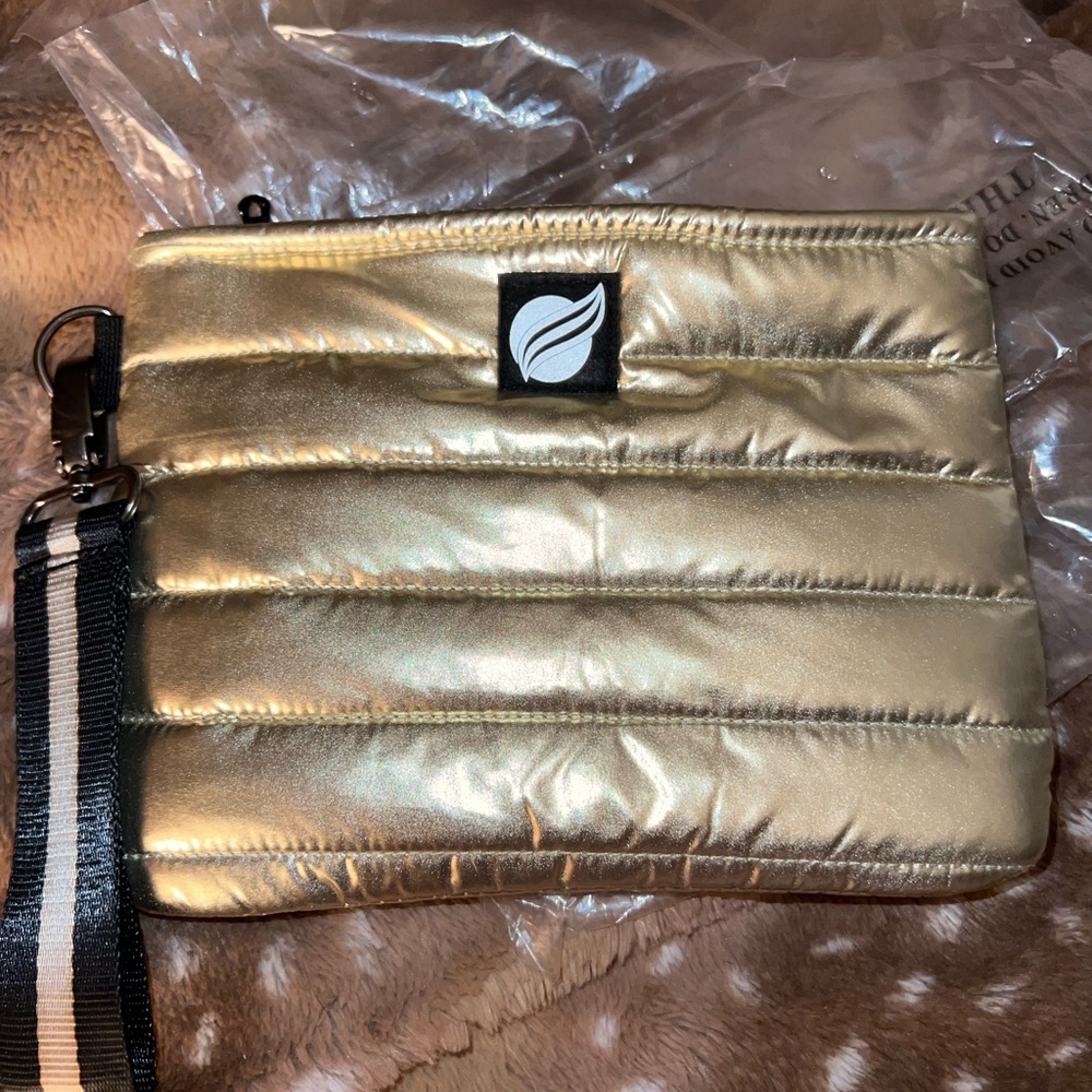 Think Royln gold wristlet